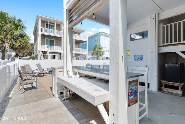 view of patio featuring a balcony