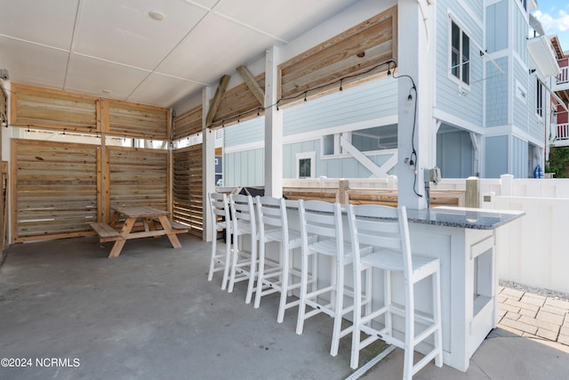 view of patio featuring outdoor dry bar