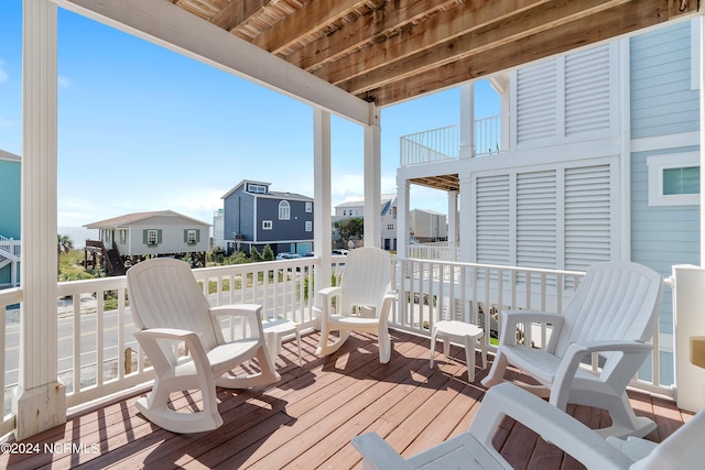 wooden terrace featuring a residential view