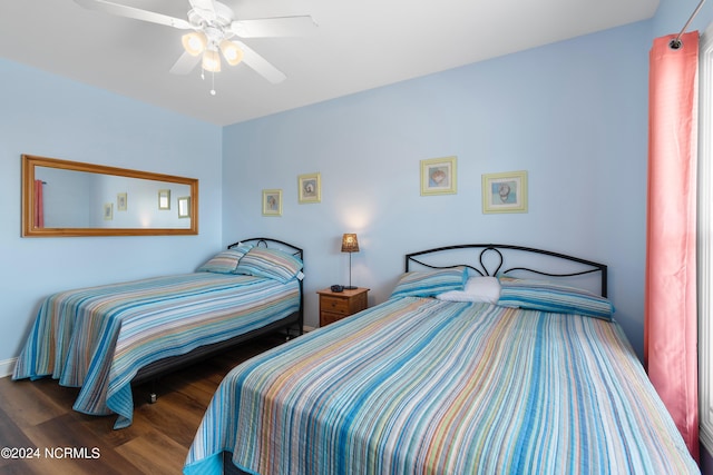 bedroom featuring a ceiling fan and wood finished floors