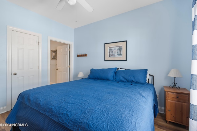 bedroom featuring wood-type flooring and ceiling fan