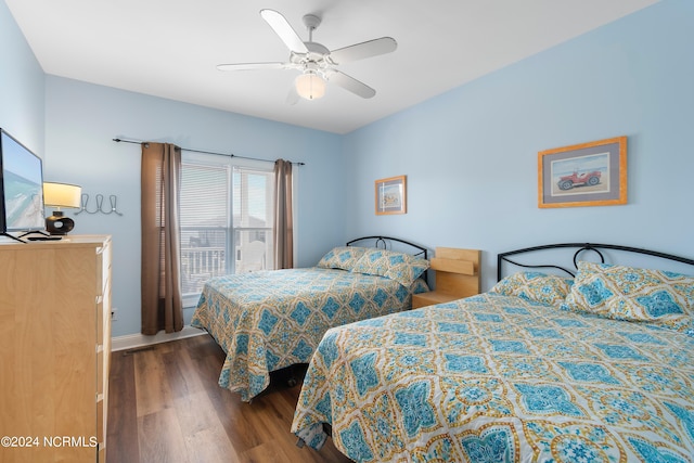 bedroom with ceiling fan and hardwood / wood-style flooring