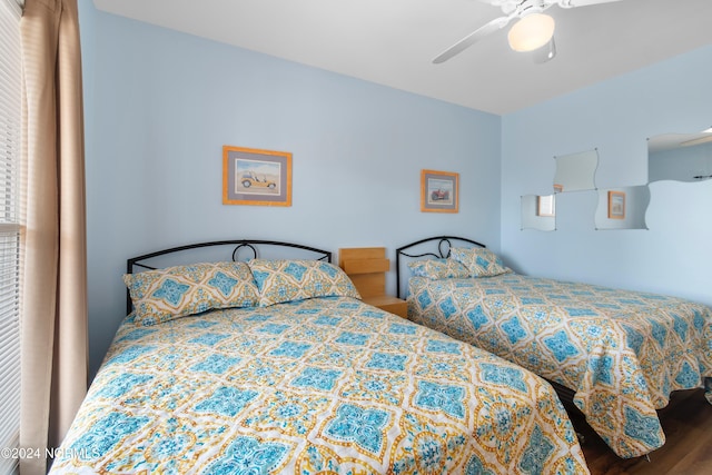 bedroom with wood finished floors and ceiling fan