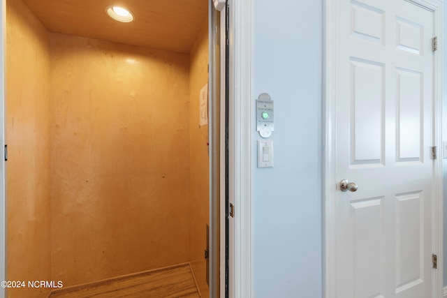 room details with wood-type flooring and elevator