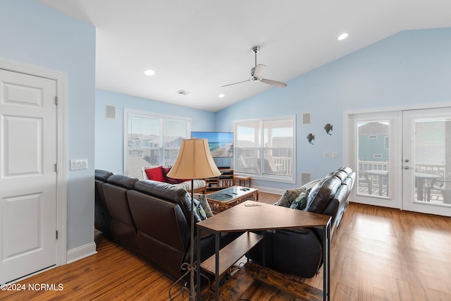 living room with ceiling fan, hardwood / wood-style flooring, french doors, and vaulted ceiling