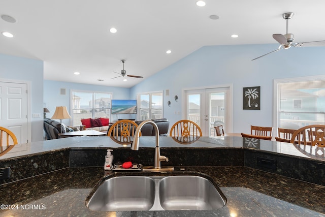 kitchen with lofted ceiling, a ceiling fan, a sink, and recessed lighting