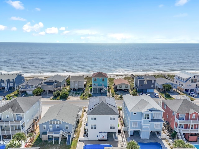 birds eye view of property with a residential view, a view of the beach, and a water view