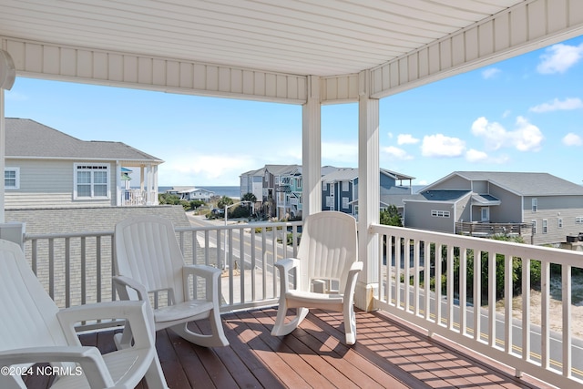 wooden deck featuring a residential view