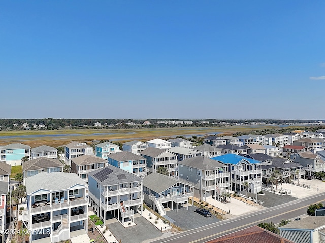 birds eye view of property featuring a residential view and a water view
