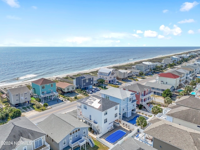 aerial view featuring a water view and a beach view