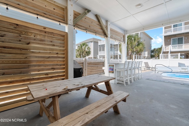 view of patio / terrace with fence, a fenced in pool, and outdoor dining area
