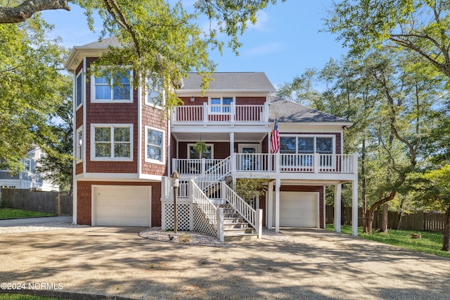 view of front of home with covered porch and a garage