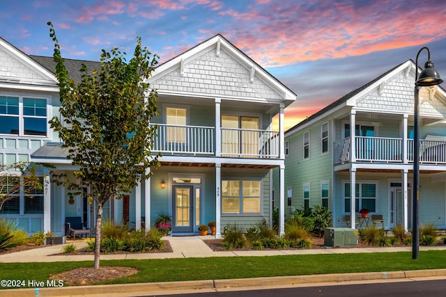 view of front of house with a balcony