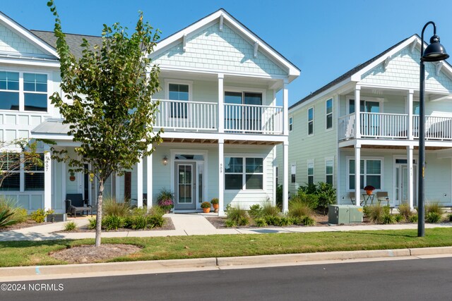 view of front of property with a balcony