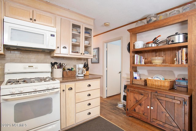 kitchen featuring backsplash, white appliances, dark hardwood / wood-style flooring, light brown cabinetry, and ornamental molding