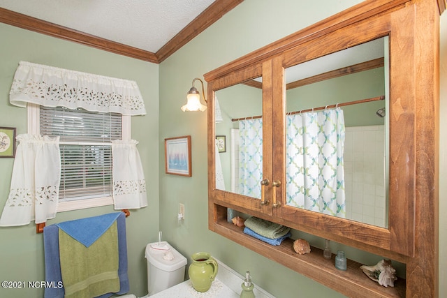 bathroom featuring walk in shower, crown molding, toilet, and a wealth of natural light