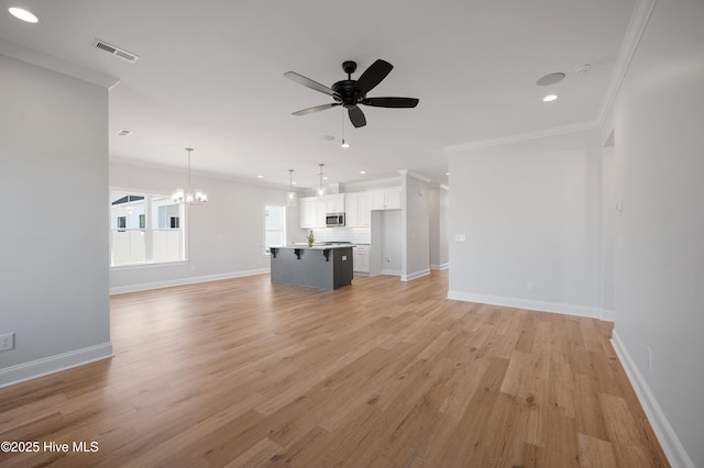 unfurnished living room with ornamental molding, ceiling fan with notable chandelier, and light hardwood / wood-style flooring