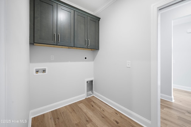 laundry area featuring cabinets, washer hookup, crown molding, hookup for an electric dryer, and light wood-type flooring