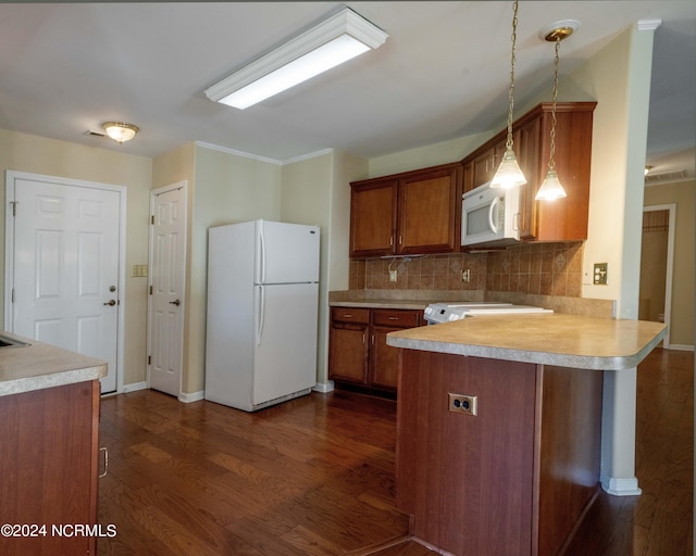 kitchen with kitchen peninsula, white appliances, decorative light fixtures, dark hardwood / wood-style floors, and decorative backsplash