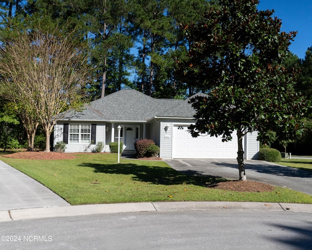 view of front of house with a garage and a front lawn