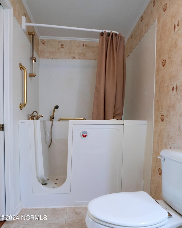 bathroom featuring a shower with shower curtain, tile patterned floors, and toilet