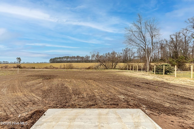 view of yard with a rural view