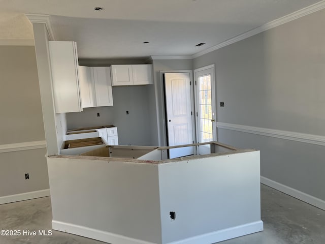 kitchen with a center island and white cabinetry