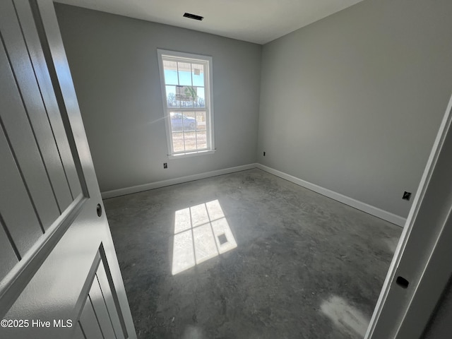 spare room featuring concrete floors