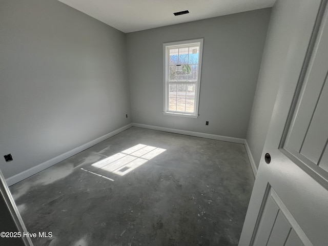 spare room featuring concrete floors