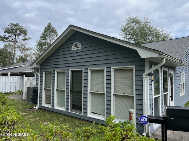 view of side of property featuring central AC unit