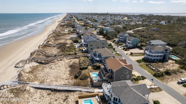 aerial view featuring a water view and a beach view