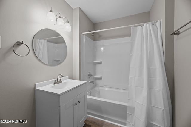 bathroom featuring vanity, shower / bath combo, and hardwood / wood-style floors