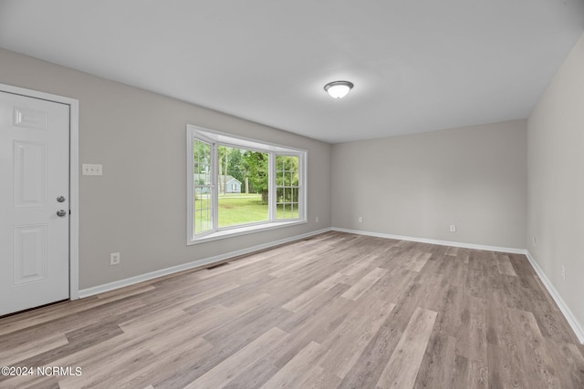 empty room with light wood-type flooring