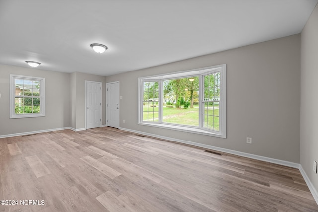 empty room with light wood-type flooring