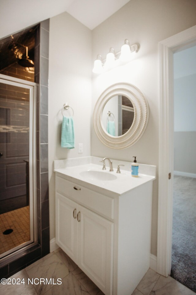 bathroom with walk in shower and vanity