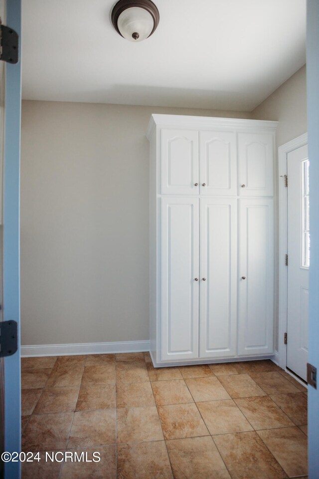 interior space featuring tile patterned flooring