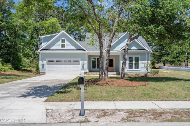 craftsman-style home featuring a front yard and a garage