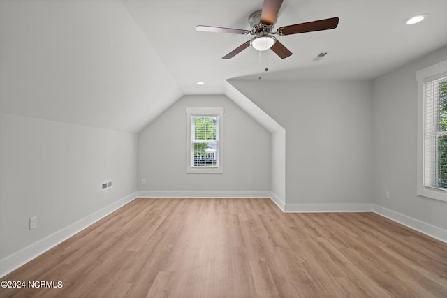 additional living space with ceiling fan, lofted ceiling, and light hardwood / wood-style floors