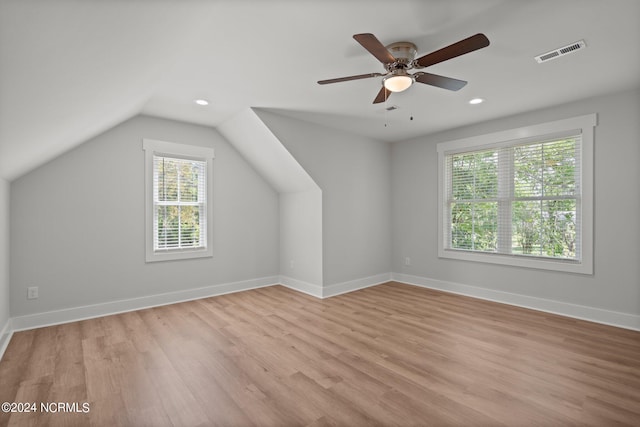 additional living space with ceiling fan, lofted ceiling, and light hardwood / wood-style flooring