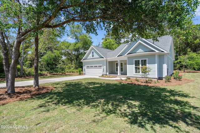 view of front of house featuring a garage and a front yard