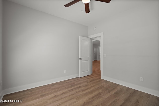 unfurnished room featuring ceiling fan and light hardwood / wood-style flooring