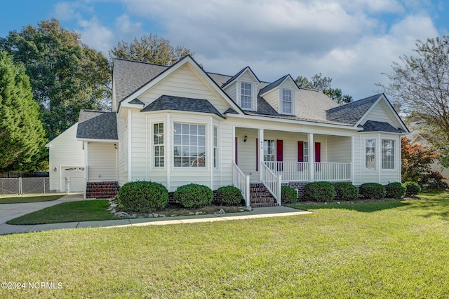 cape cod-style house with a porch and a front yard