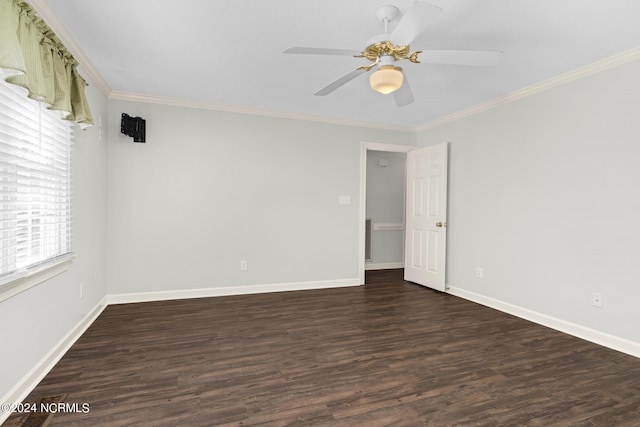 spare room with dark hardwood / wood-style floors, crown molding, and ceiling fan