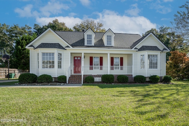 view of front of home featuring a front lawn and covered porch