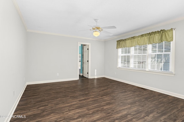 unfurnished room featuring ceiling fan, dark hardwood / wood-style floors, and crown molding