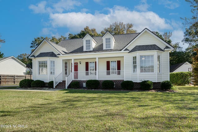 view of front facade with a front lawn and covered porch