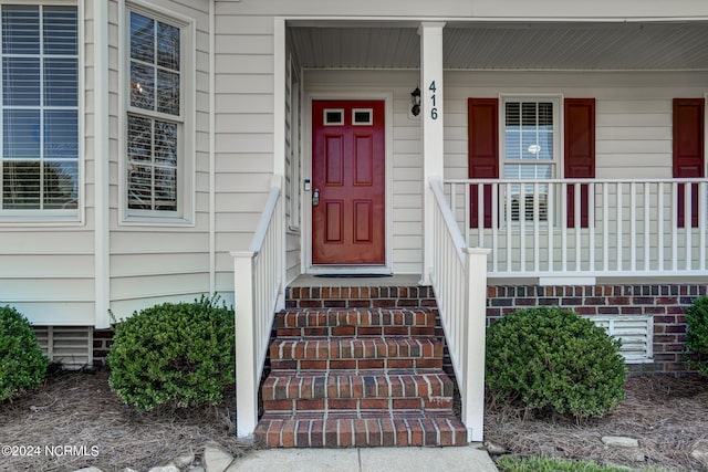 property entrance with a porch