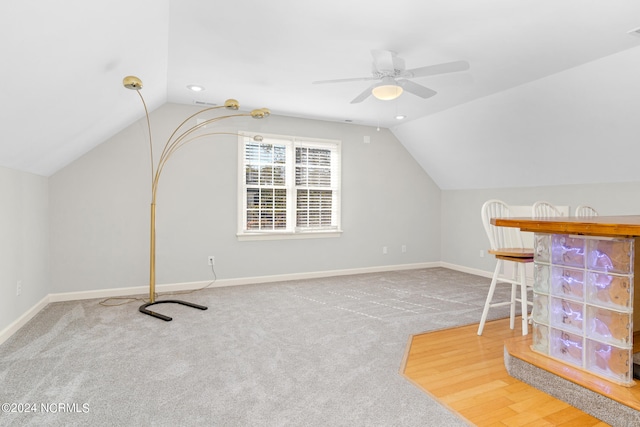 additional living space featuring ceiling fan, hardwood / wood-style flooring, and lofted ceiling