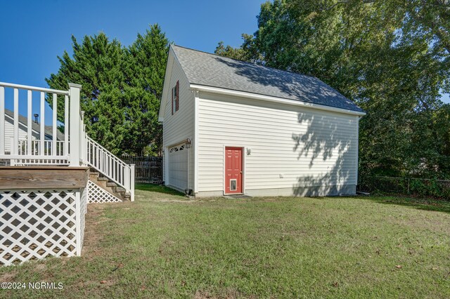 view of outdoor structure with a lawn