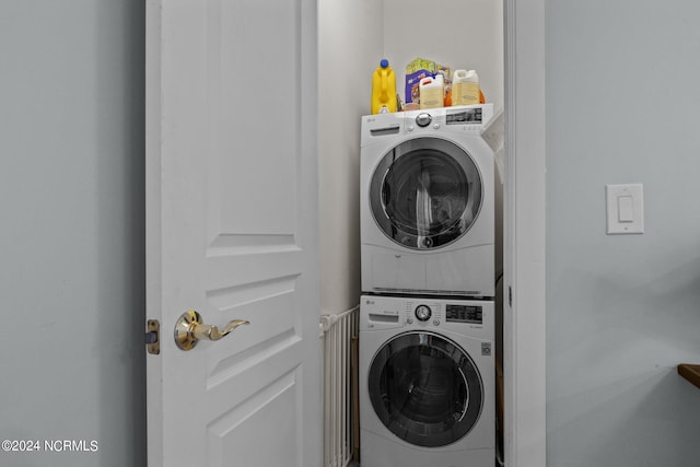 washroom with stacked washer / dryer